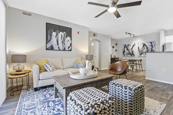 a living room with a couch and a table at Ascent Apartments, Utah, 84121